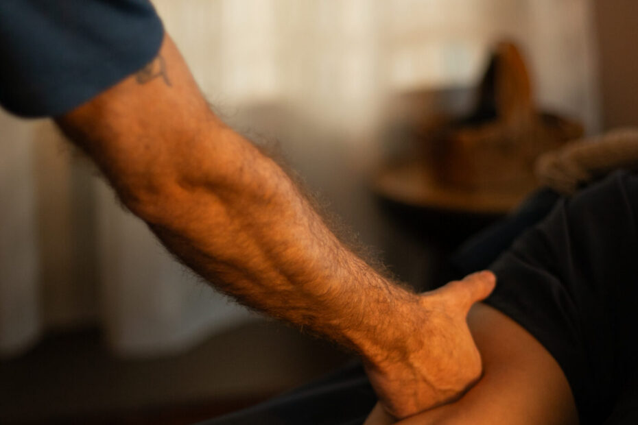 Massage Therapist Performing Deep Tissue Massage on clients lower leg